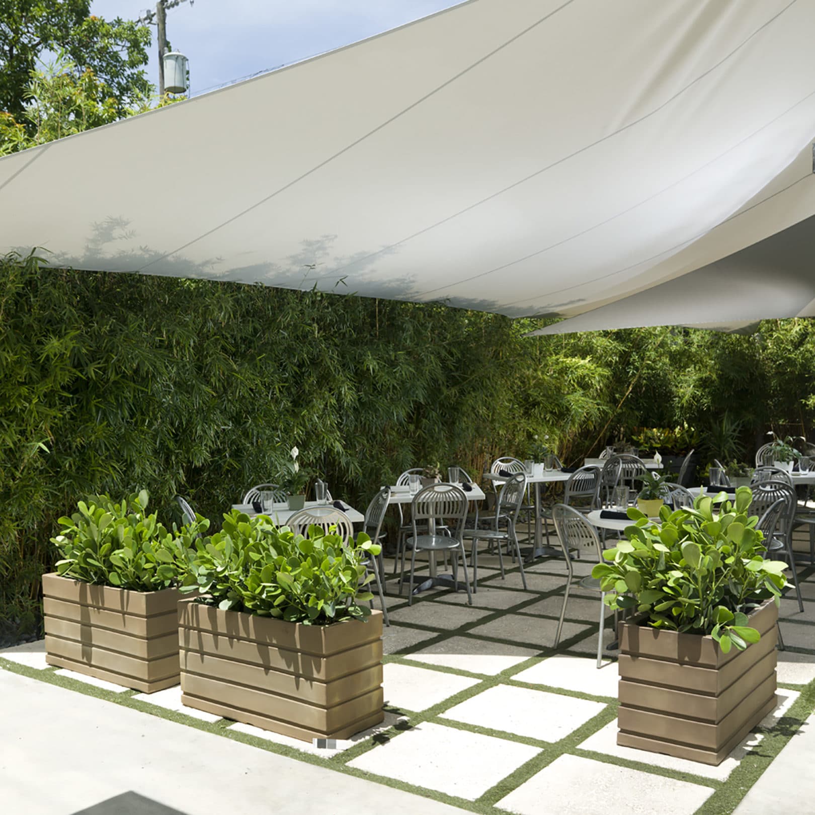 Restaurant outdoor seating with Ellis Planters